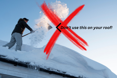 man using shovel on roof to remove snow